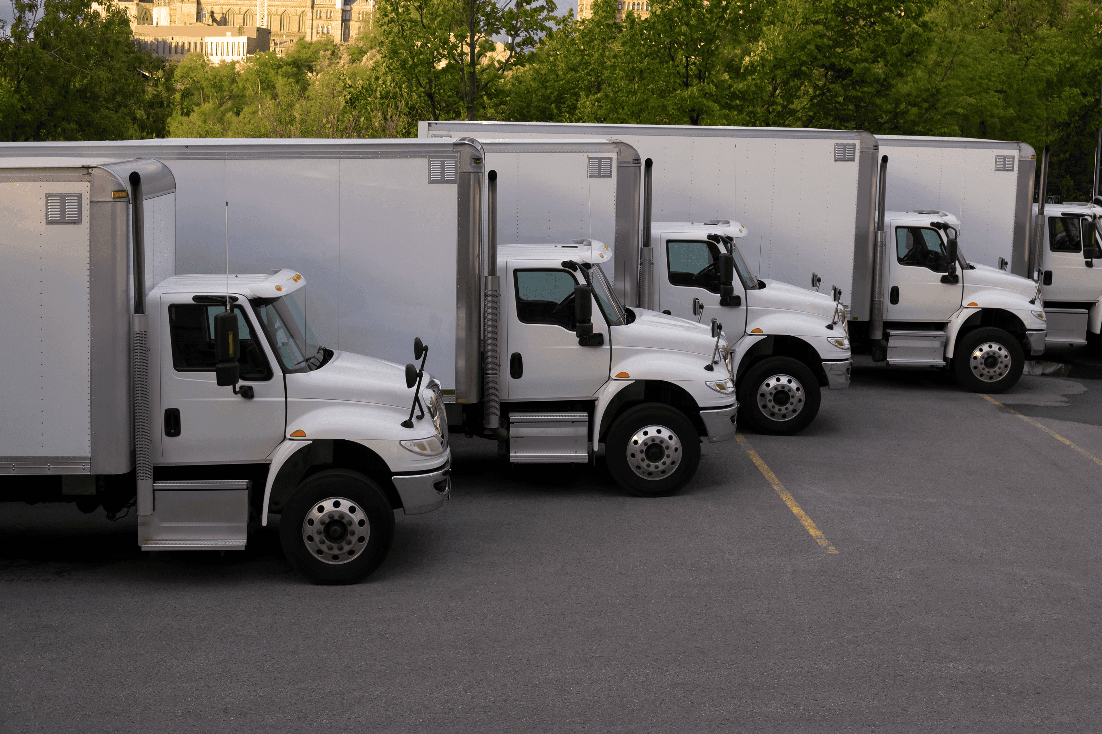 Fleet of white boxed trucks