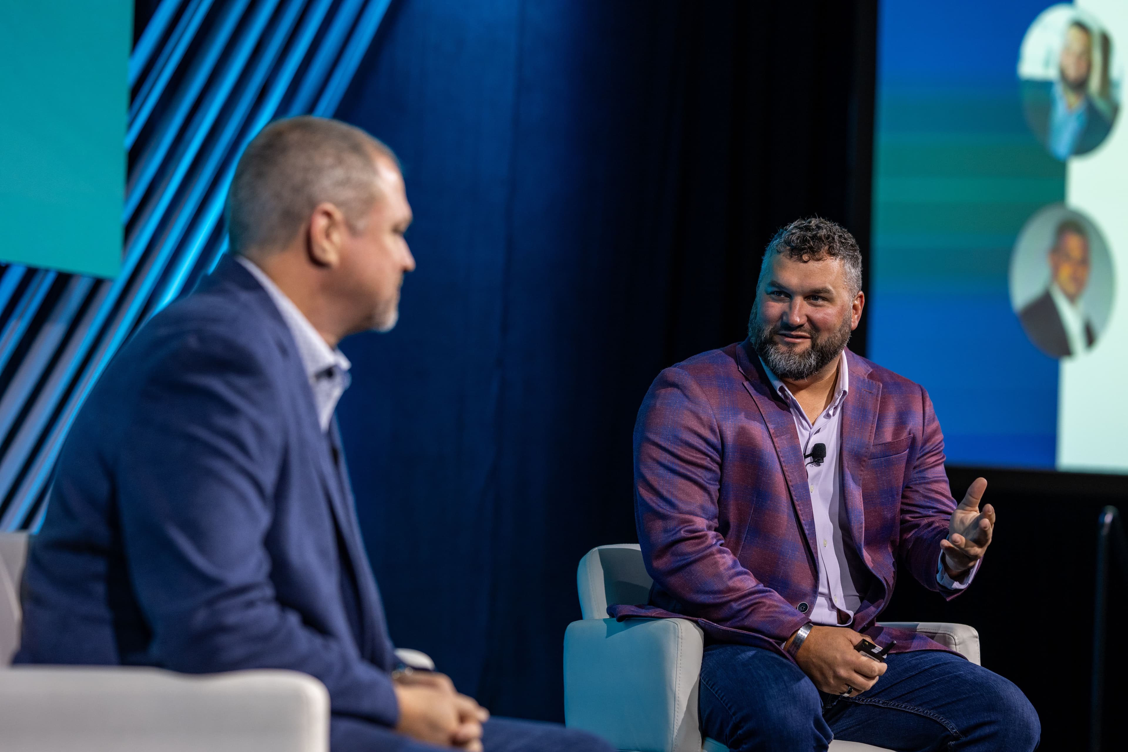 Two men on stage talking