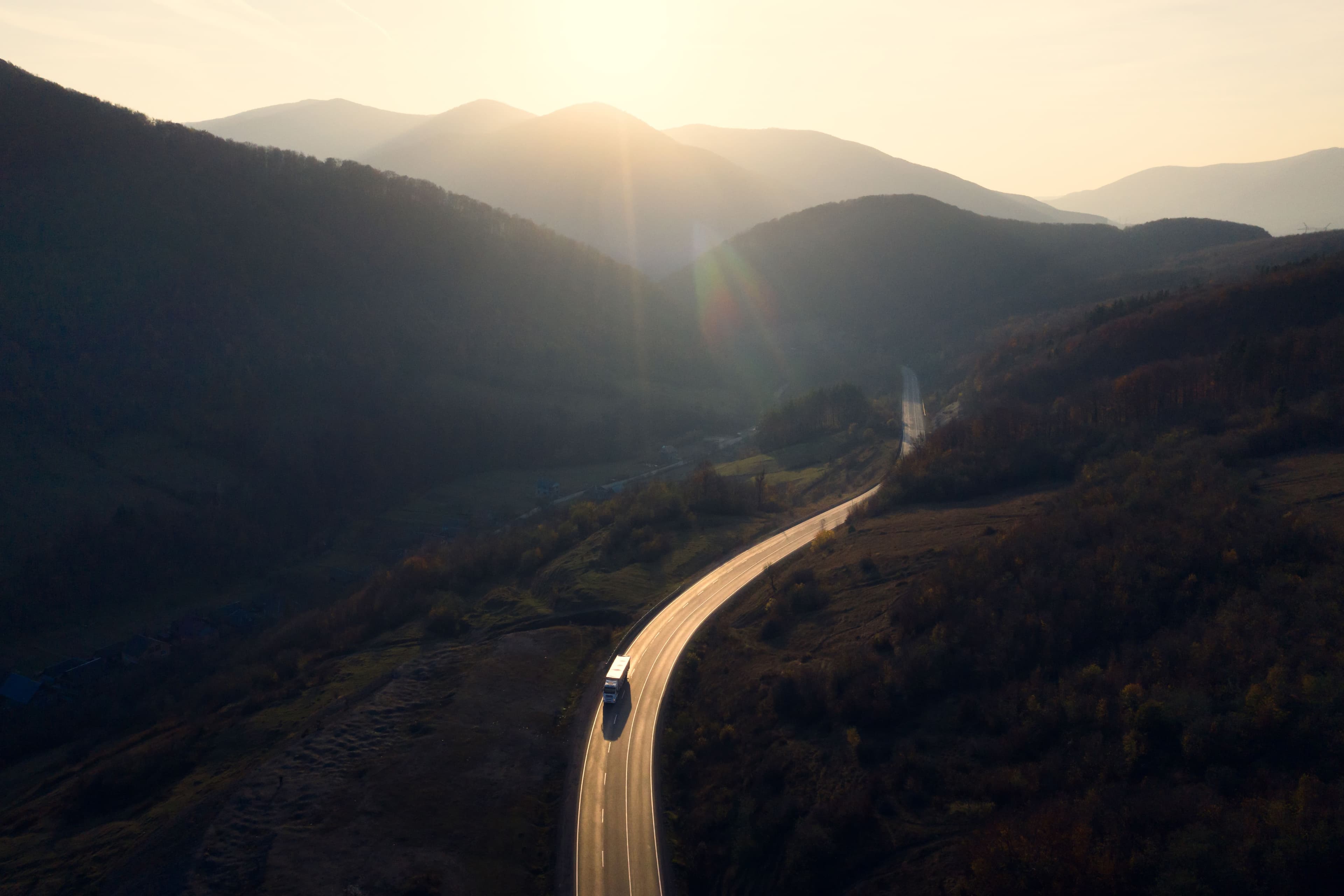 Truck driving through a mountainous road