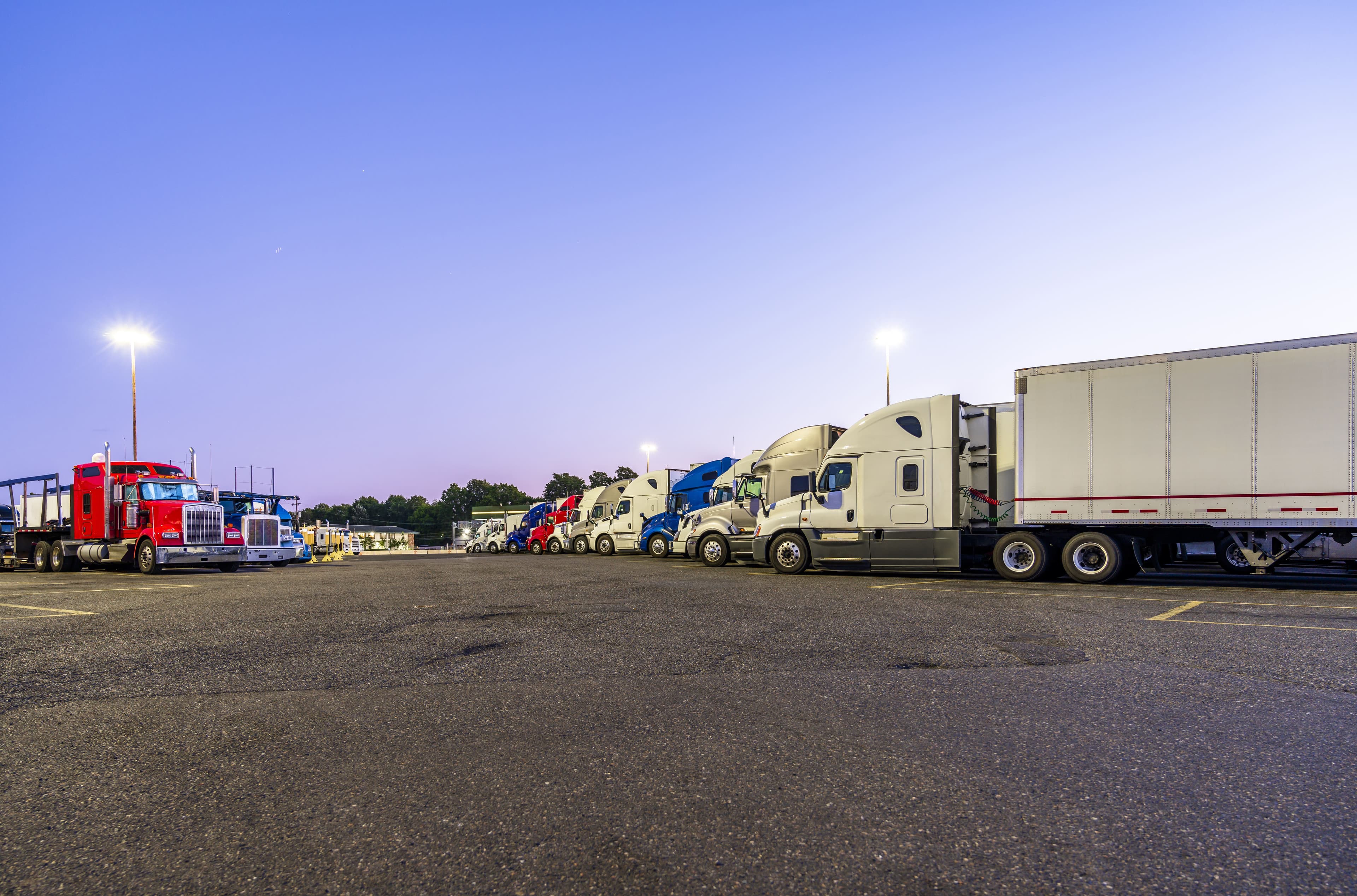 Semi trucks in parking log